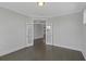 Home office with hardwood floors, white trim, and glass French doors leading to another room at 2006 Riverbend Dr, Charleston, SC 29412