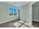 Sunlit bedroom featuring wood-look flooring and serene light-green walls at 2035 Beech Ave, North Charleston, SC 29405
