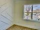 Bedroom features custom wall design, hardwood floor, and large window with natural light at 2035 Beech Ave, North Charleston, SC 29405