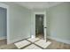 Bright, sunny bedroom with light-green walls and neutral-toned wood-look flooring at 2035 Beech Ave, North Charleston, SC 29405