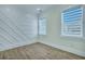 Inviting bedroom with a decorative accent wall and bright, natural light at 2035 Beech Ave, North Charleston, SC 29405