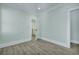 Bright bedroom with light walls, white trim, and wood-look flooring at 2035 Beech Ave, North Charleston, SC 29405