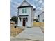 Charming two-story home with white siding, black trim, and a well-maintained front yard at 2035 Beech Ave, North Charleston, SC 29405