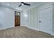 Inviting living space with unique wood door, white trim, and modern lighting fixtures at 2035 Beech Ave, North Charleston, SC 29405