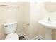 Compact half-bath with a pedestal sink, toilet, and modern fixtures at 204 Tyner Trl, Summerville, SC 29486