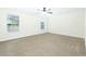 Spacious bedroom with neutral carpet, ceiling fan, and plenty of natural light from large window at 204 Tyner Trl, Summerville, SC 29486