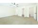 Large bedroom with ceiling fan and two doors to bathrooms; neutral carpet at 204 Tyner Trl, Summerville, SC 29486