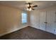 Cozy bedroom featuring carpet flooring, a ceiling fan, and a double door closet at 204 Tyner Trl, Summerville, SC 29486