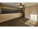 Loft space with carpet flooring, a ceiling fan, and natural lighting at 204 Tyner Trl, Summerville, SC 29486