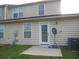 Exterior view of the home showing a back door entrance and satellite dish at 204 Tyner Trl, Summerville, SC 29486