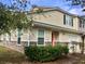 Inviting townhome with tan siding, stone accents, and a well-manicured lawn at 204 Tyner Trl, Summerville, SC 29486