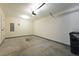Spacious two-car garage featuring an automatic door and concrete flooring, offering convenience and practicality at 204 Tyner Trl, Summerville, SC 29486