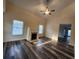 Inviting living room with a fireplace, high ceilings, and modern wood-look floors at 204 Tyner Trl, Summerville, SC 29486