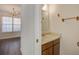 A half bathroom with a sink, mirror, and towel rack at 205 Weber Rd # B, Summerville, SC 29483