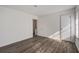 Bright bedroom features wood-look flooring, white walls, window with blinds, and closet at 205 Weber Rd # B, Summerville, SC 29483