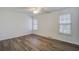 Bright bedroom featuring wood-look flooring and ample natural light from two windows at 205 Weber Rd # B, Summerville, SC 29483