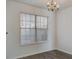 Bright dining area with large windows and a stylish chandelier, perfect for Gathering meals at 205 Weber Rd # B, Summerville, SC 29483