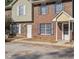 Brick townhome exterior with shuttered windows and individual unit entrances at 205 Weber Rd # B, Summerville, SC 29483