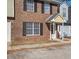 Multi-Gathering townhome brick exterior with black shutters and sidewalks at 205 Weber Rd # B, Summerville, SC 29483