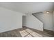 Open living area featuring modern flooring, white walls and a staircase at 205 Weber Rd # B, Summerville, SC 29483