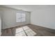 Spacious living room with modern flooring, a bright window, and neutral walls at 205 Weber Rd # B, Summerville, SC 29483