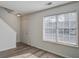 Living room with wood-look flooring, white walls, and a staircase at 205 Weber Rd # B, Summerville, SC 29483