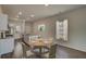 Bright dining area featuring an island kitchen, stainless appliances, and a cozy round table at 206 Pine Crest View Dr, Summerville, SC 29486