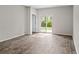 Spacious empty room with hardwood floors and a sliding glass door leading to the outdoors at 206 Pine Crest View Dr, Summerville, SC 29486
