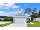 New home featuring blue siding, a two-car garage, and a scenic water view at 206 Pine Crest View Dr, Summerville, SC 29486