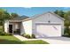 Charming single-story home featuring a two-car garage, stone accents, and manicured landscaping at 206 Pine Crest View Dr, Summerville, SC 29486