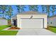 Attractive single-story home with a spacious two-car garage, and fresh landscaping at 206 Pine Crest View Dr, Summerville, SC 29486