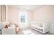 Charming Bedroom with a crib, soft pink walls, and a bright, airy feel at 208 Pine Crest View Dr, Summerville, SC 29486