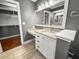 Bathroom with a vanity, a granite countertop, drawers and storage and a view into a walk-in closet at 209 E 4Th S St, Summerville, SC 29483