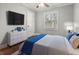 Cozy bedroom with hardwood floors, a large window and light walls at 209 E 4Th S St, Summerville, SC 29483