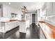 Bright, updated kitchen featuring white cabinets, butcher block countertops, and stainless steel appliances at 209 E 4Th S St, Summerville, SC 29483