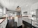Bright kitchen featuring white cabinets, butcher block countertops and a center island at 209 E 4Th S St, Summerville, SC 29483