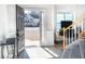 Bright foyer with wood floors, open staircase, and a view of the home's exterior at 215 Evesham Dr, Summerville, SC 29485