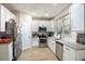 Well-lit kitchen with stainless steel appliances, granite countertops and white cabinetry at 215 Evesham Dr, Summerville, SC 29485