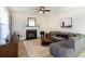 Comfortable living room features a fireplace, ceiling fan and modern décor at 215 Evesham Dr, Summerville, SC 29485