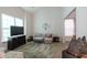 Cozy living room featuring a high ceiling, large window, and comfortable seating at 215 Evesham Dr, Summerville, SC 29485