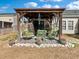 Backyard features a gazebo with hanging chairs and outdoor seating on a brick patio at 219 Border Rd, Goose Creek, SC 29445