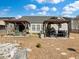 A backyard with two gazebos, one with lounge chairs, and the other with a built-in grill at 219 Border Rd, Goose Creek, SC 29445