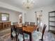 Elegant dining room with a chandelier, stylish furniture, and a view into the entryway at 219 Border Rd, Goose Creek, SC 29445