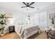 Serene main bedroom with a ceiling fan, neutral tones, natural light and hardwood floors at 2200 Belle Isle Ave # 103, Mount Pleasant, SC 29464