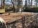 Fenced backyard featuring mature trees and plenty of space for outdoor activities at 2219 N Dallerton Cir, Charleston, SC 29414