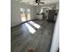 Open-concept living area with hardwood floors, bright natural light, and easy access to deck at 2219 N Dallerton Cir, Charleston, SC 29414