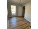 Bright bedroom with hardwood floors and ample natural light streaming through a large window at 222 Braly Dr, Summerville, SC 29485