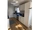 Well-lit kitchen featuring white cabinets, stainless steel appliances, and hardwood floors at 222 Braly Dr, Summerville, SC 29485