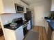 Modern kitchen with stainless steel appliances, granite countertops, and hardwood floors at 222 Braly Dr, Summerville, SC 29485