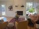 Cozy living room with a brick fireplace, modern decor, and lots of natural light at 222 Braly Dr, Summerville, SC 29485